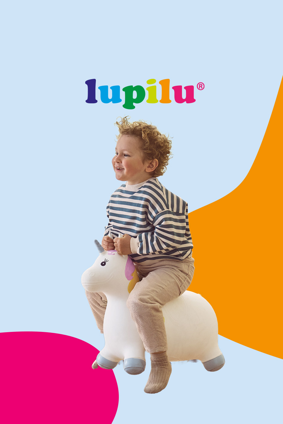 Happy toddler on a unicorn bouncy toy, with colorful shapes and text.