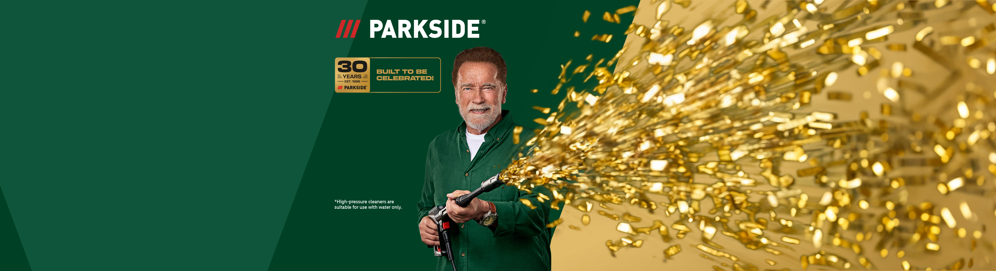 Arnold Schwarzenegger celebrating 30 years of tools with golden confetti from a pressure washer.