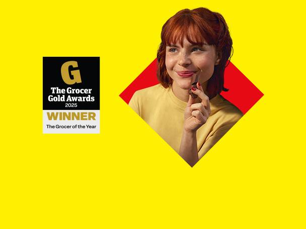 Woman holding a chocolate bar, next to a 'Grocer Gold Awards 2025 Winner' badge.