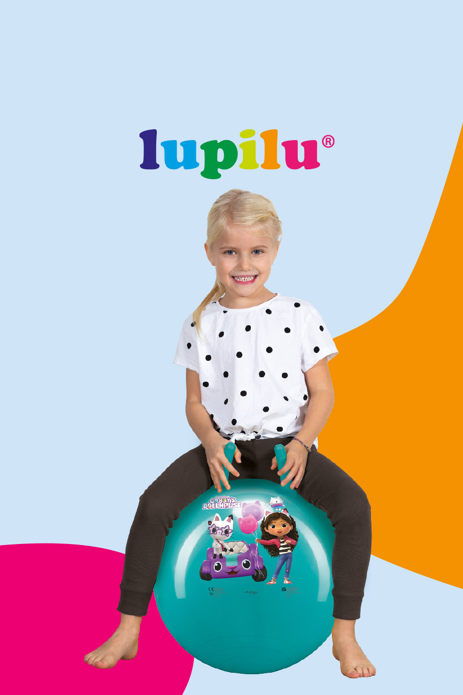Smiling girl on a teal hopper ball with cartoon characters, against a blue and orange background.