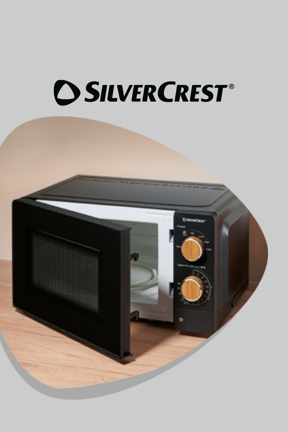 Black microwave oven with door open, showing a glass turntable inside.