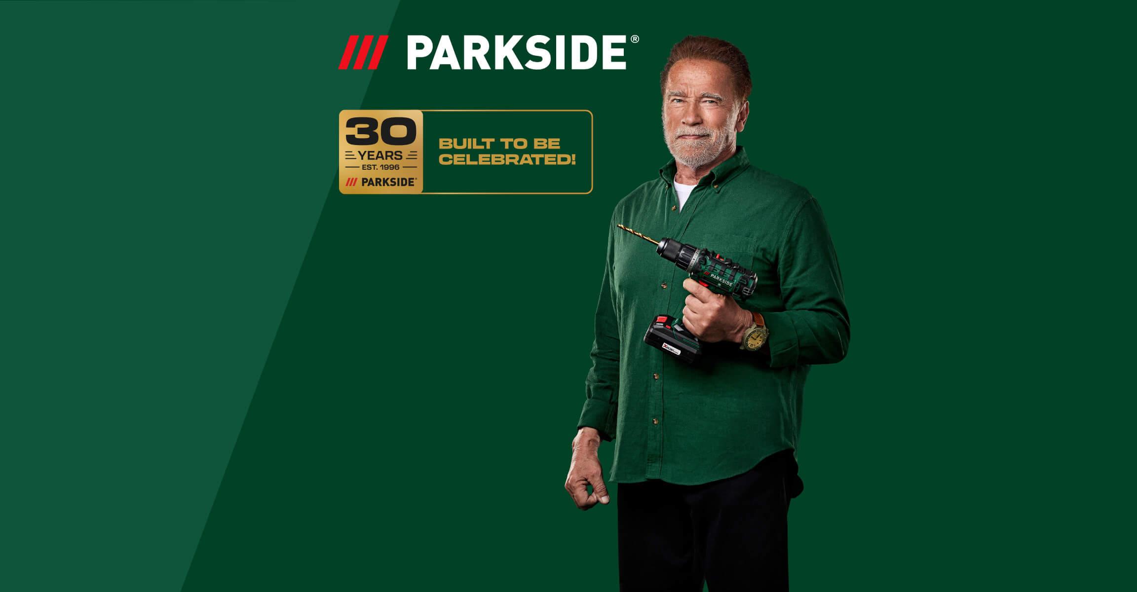 Man holding a cordless drill, celebrating 30 years of tools.