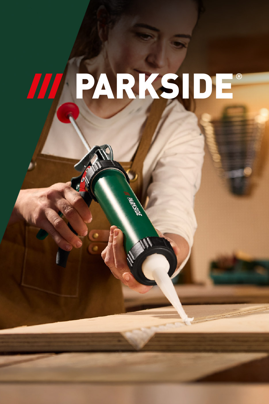 Woman applying sealant with a green caulk gun to wooden boards.