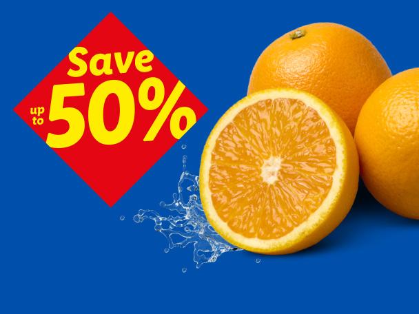 Fresh oranges with water splashes and a red diamond-shaped 'Save up to 50%' discount tag.