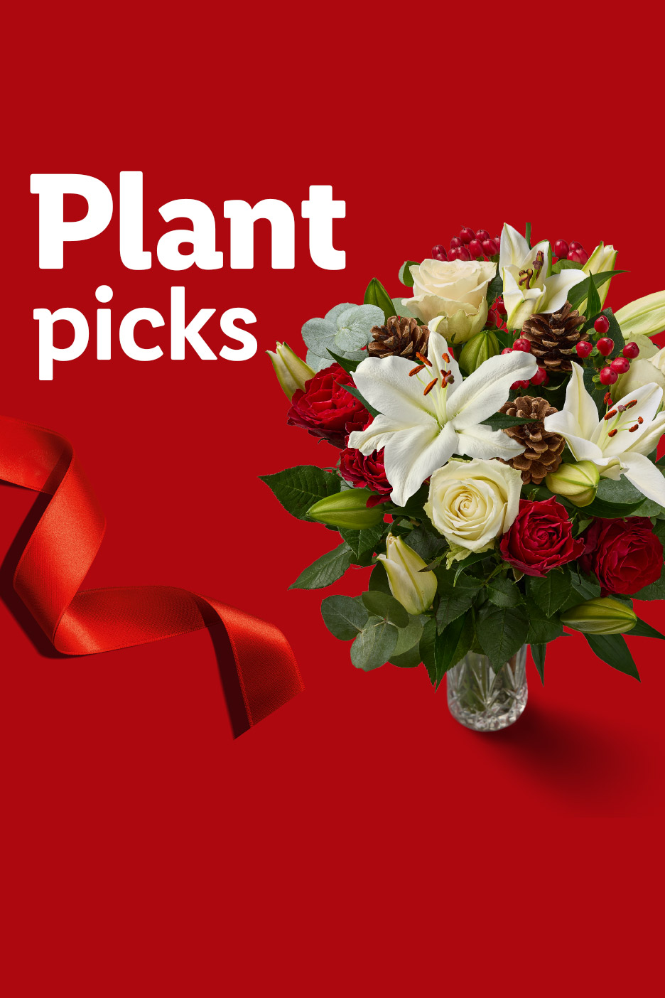 Plant picks: festive bouquet with white lilies, red and white roses, pinecones, and red berries.