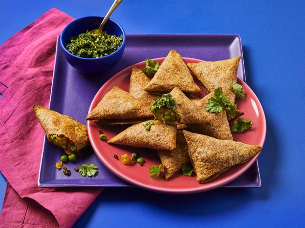 Vegetable samosas with dipping sauce.