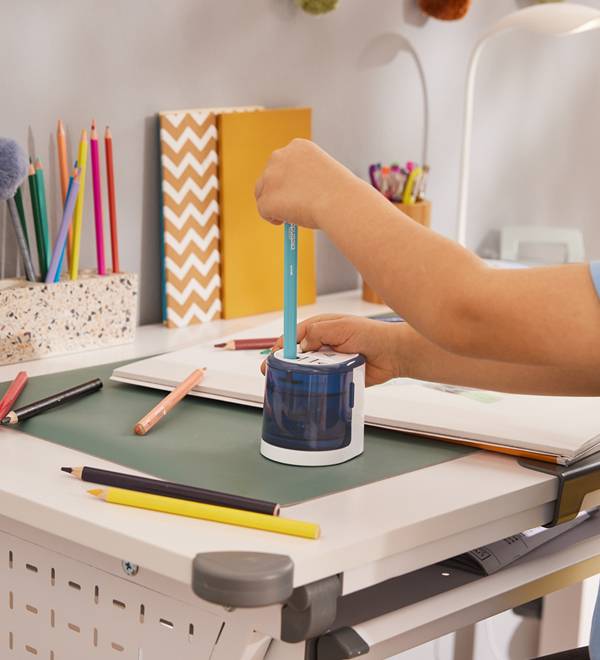 Pencil sharpener and colored pencils.