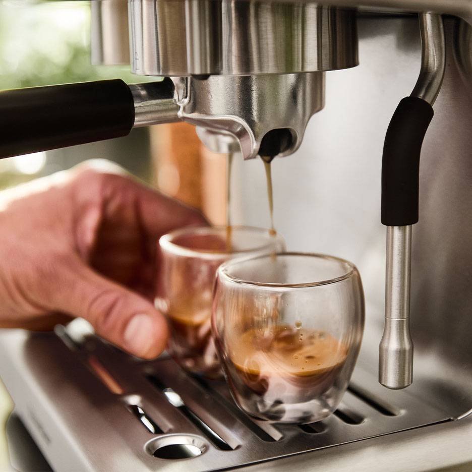 Espresso machine brewing two cups of espresso.