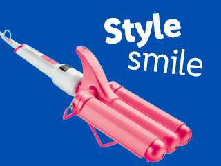 Pink triple barrel curling iron for styling hair.