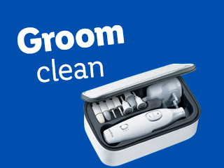 A Braun grooming kit with various attachments in its case.
