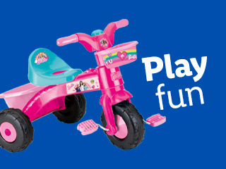 Barbie-themed pink tricycle with a basket, perfect for playtime fun.