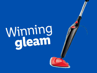 A black and red steam mop cleans, achieving a winning gleam.