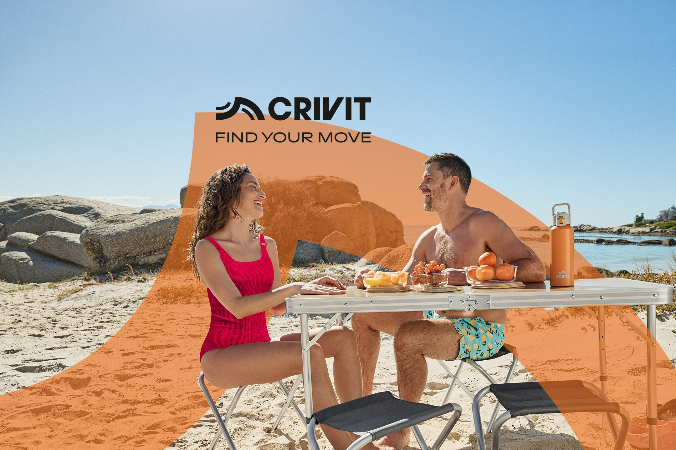 Couple enjoying a beach picnic with a portable table and chairs, fruit, and a water bottle. Text: FIND YOUR MOVE.