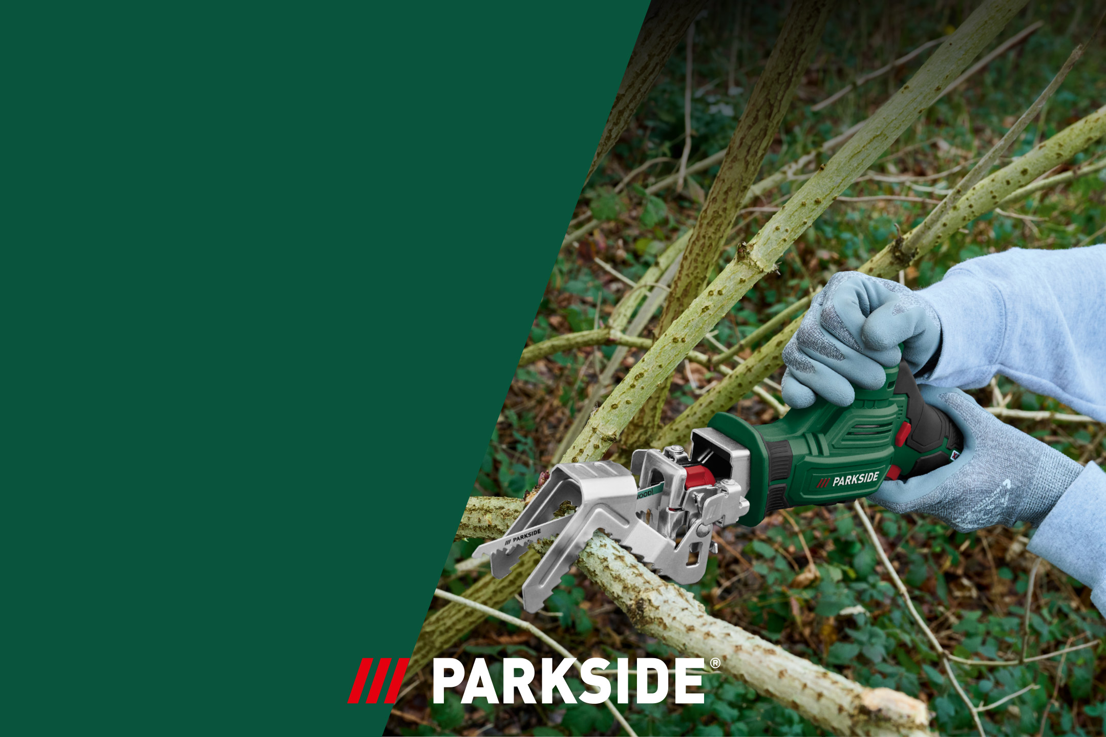 A person wearing gloves uses a green cordless pruning saw to cut a tree branch.