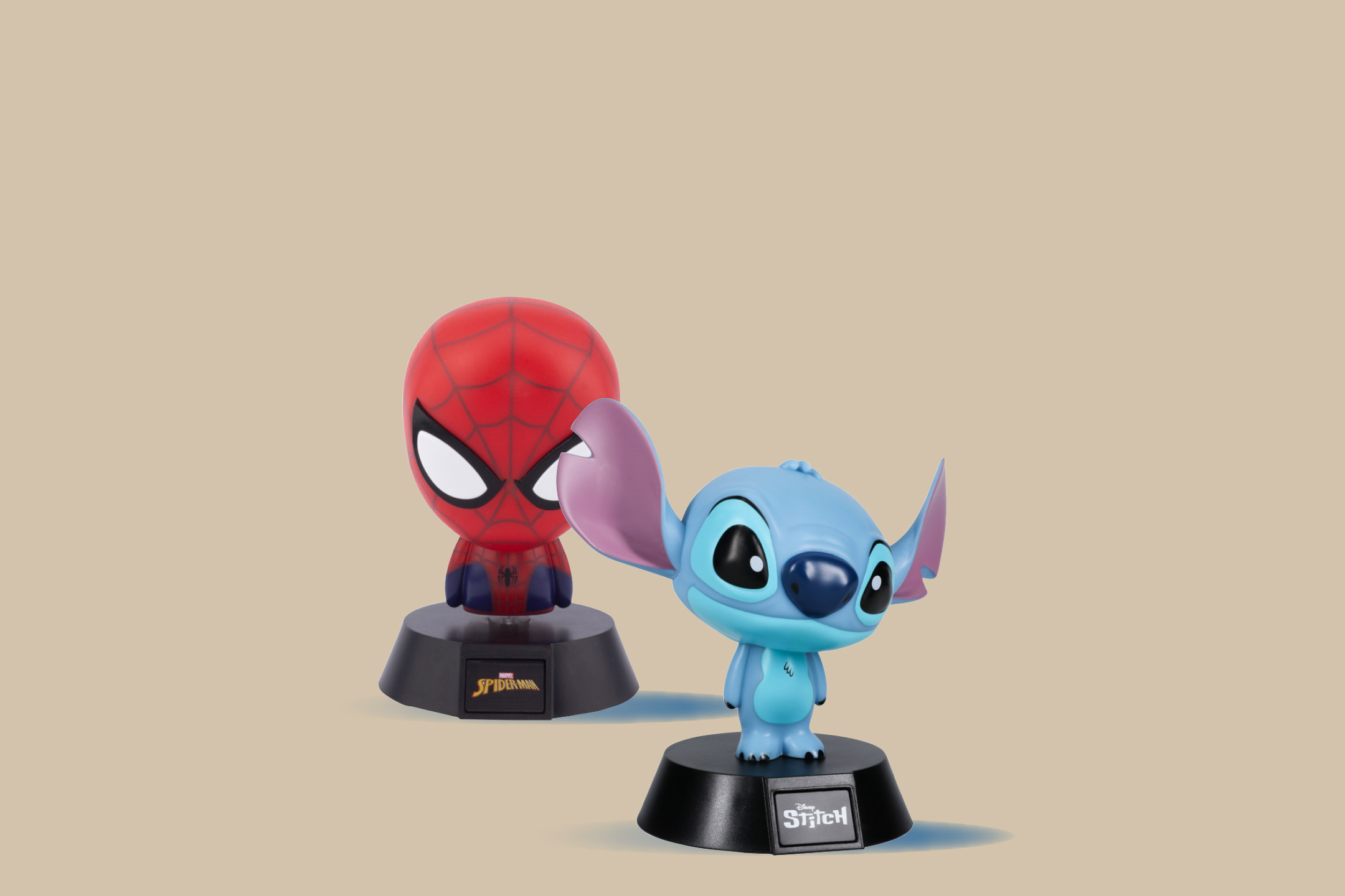 Two character night lights, one red superhero and one blue alien, on a beige background.