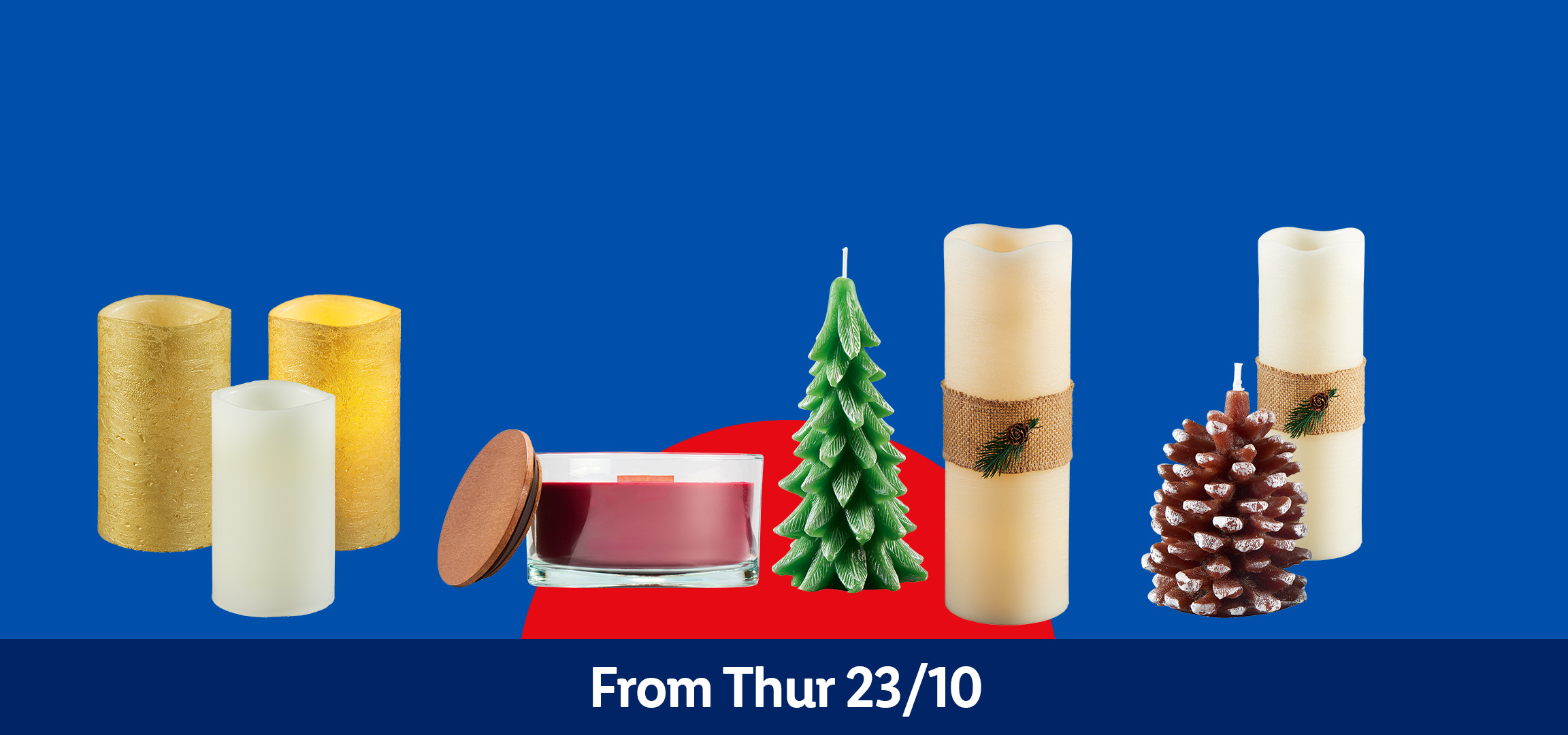 Various candles including jar candles, pillar candles, and novelty candles like a Christmas tree and pinecone, on a blue, yellow, and red background, with text 'From Thur 23/10'.