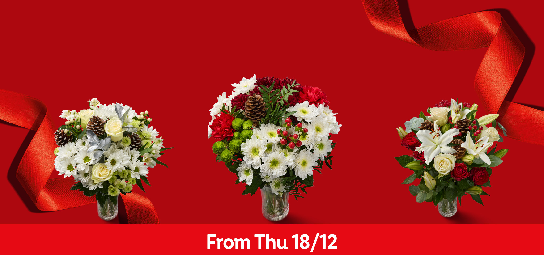 Four festive flower bouquets with red and white flowers, pinecones, and red ribbons.