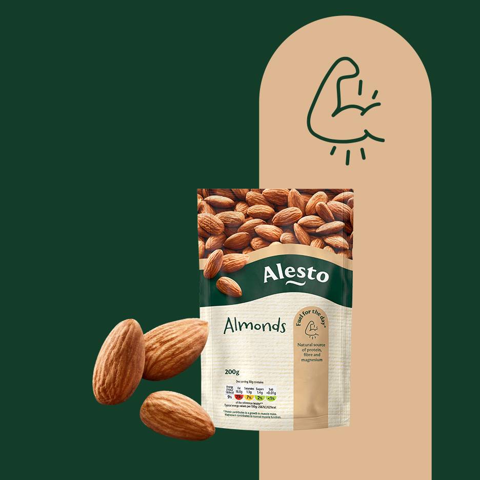 A bag of almonds with loose almonds, featuring a strong arm icon and nutritional info.