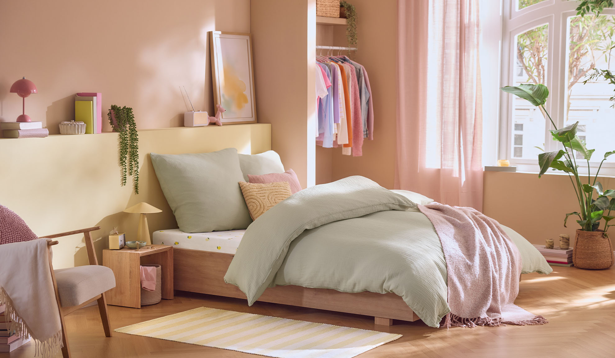 Pastel-colored bedroom with a bed, wardrobe, and plants, in a Scandinavian style.