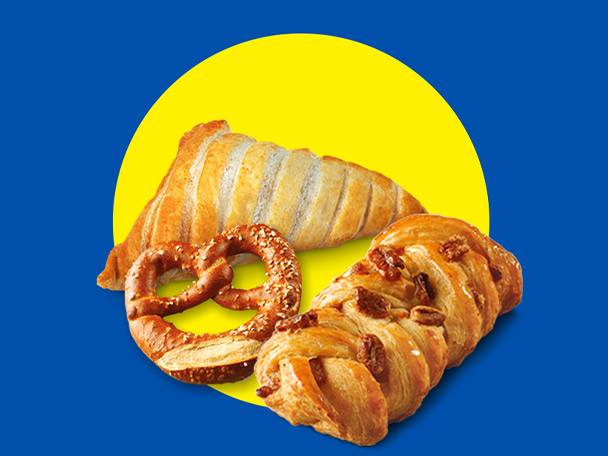 A croissant, pretzel, and pastry with nuts on a yellow circle against a blue background.