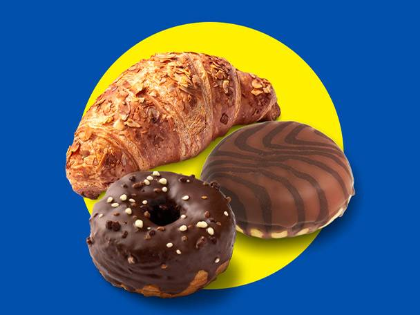 Croissant with almonds, chocolate donut, and chocolate-covered biscuit on a yellow circle.